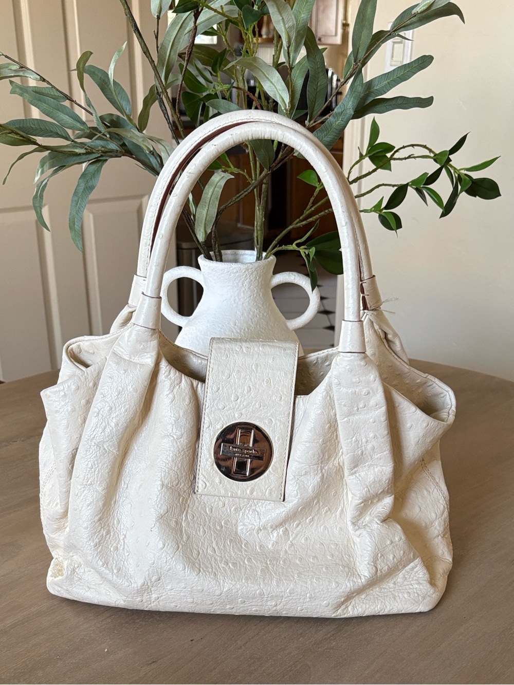 This is a Kate Spade Ivory textured leather Bexley Stevie shoulder bag